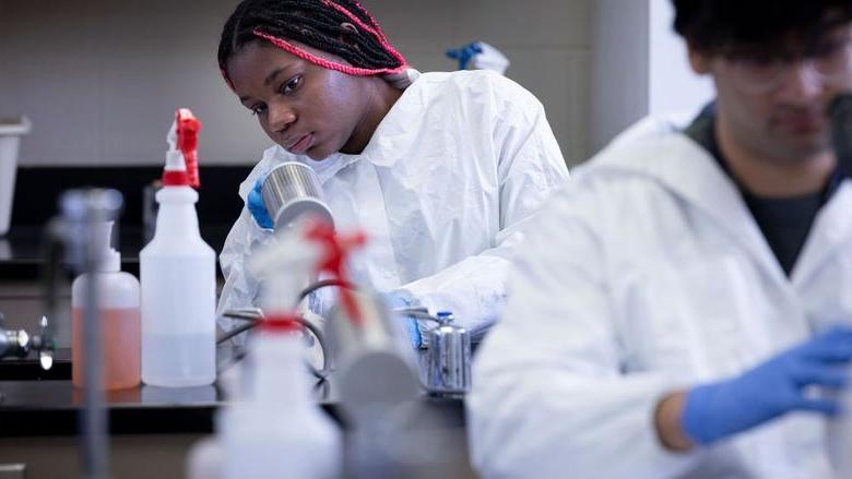 Student in a college laboratory